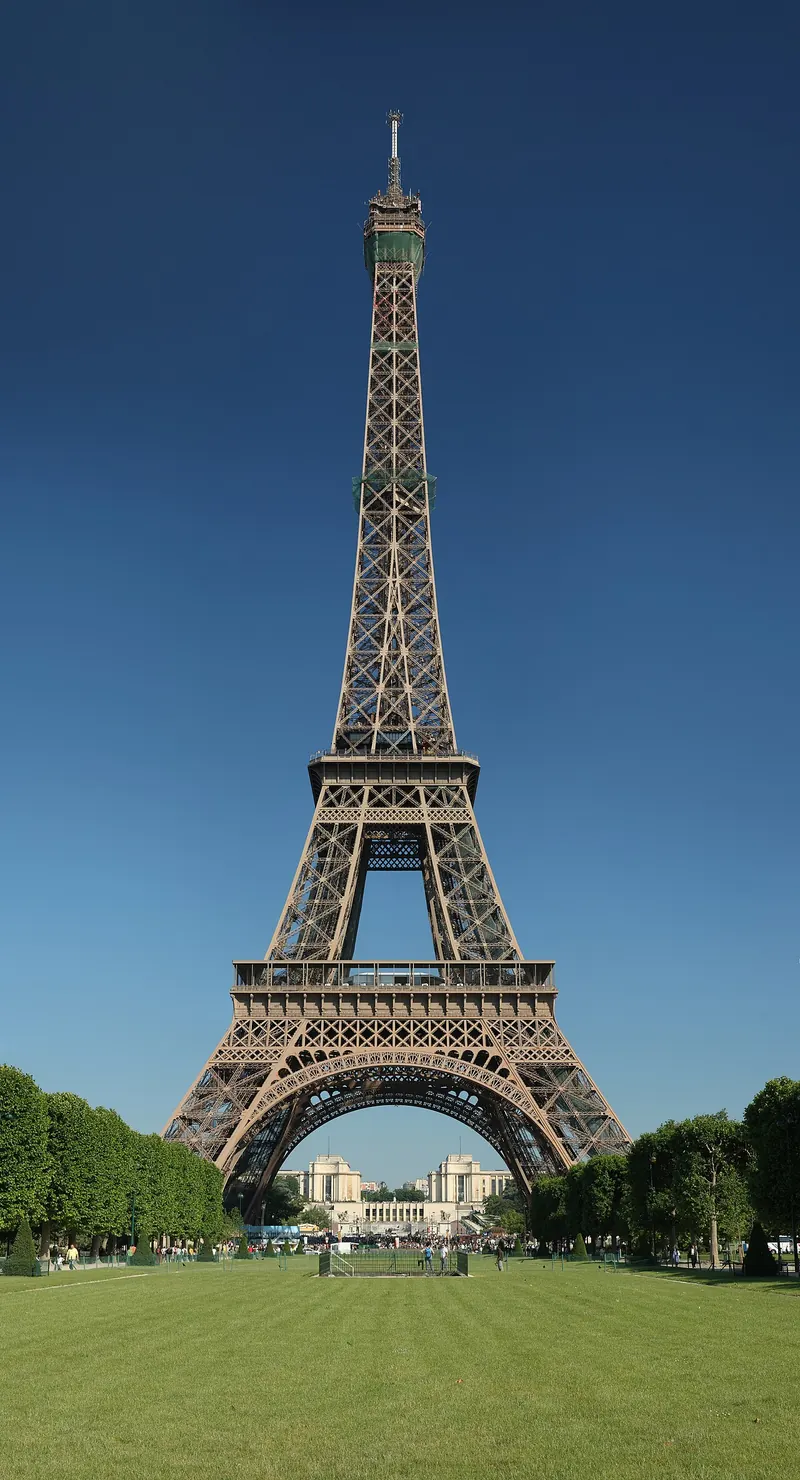 The Eiffel Tower rising above the Champ de Mars in Paris at dusk
