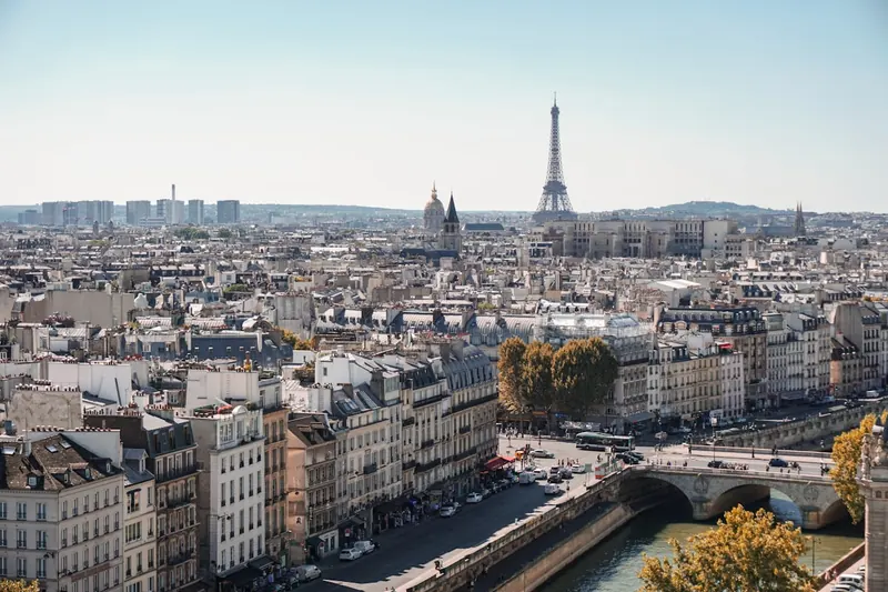 Wide view of the Eiffel Tower against a Paris sky